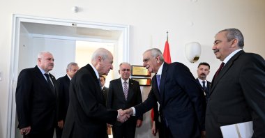 Nationalist Movement Party (MHP) leader Devlet Bahçeli (2nd L) shakes hands with Ahmet Türk, a member of the Peoples’ Equality Party (DEM Party) delegation, Ankara, Türkiye, Jan. 2, 2024. (AA Photo)