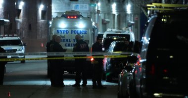Officers of the New York Police Department are seen at the location where a shooting injured 10 people in Queens, New York City, U.S., Jan. 1, 2025. (AA Photo)