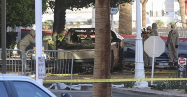Investigators photograph a Tesla Cybertruck that exploded outside the lobby of President-elect Donald Trump&#039;s hotel in Las Vegas, U.S., Jan. 1, 2025. (AFP Photo)