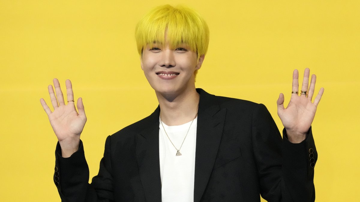 J-hope, a member of South Korean K-pop band BTS, poses for photographers ahead of a press conference to introduce their new single &quot;Butter&quot; in Seoul, South Korea, May 21, 2021. (AP Photo)