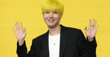 J-hope, a member of South Korean K-pop band BTS, poses for photographers ahead of a press conference to introduce their new single &quot;Butter&quot; in Seoul, South Korea, May 21, 2021. (AP Photo)