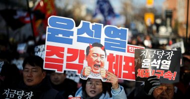 Protesters hold signs that read, "Arrest Yoon Suk Yeol immediately," during a rally against the impeached South Korean President Yoon Suk Yeol near his official residence, Seoul, South Korea, Jan. 3, 2025. (Reuters Photo)