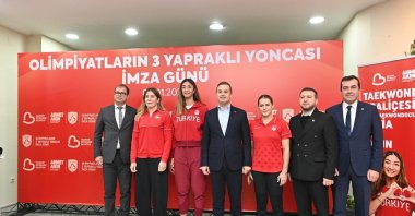 Balıkesir Metropolitan Municipality Mayor Ahmet Akın (C) poses for a photo after the renewal of contracts with Olympic medalists Yasemin Adar Yiğit (2nd L) and Esra Yıldız Kahraman (2nd L), Balıkesir, Türkiye, Jan. 2, 2025. (IHA Photo)