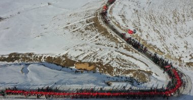 Thousands of people walk together in the snowy mountains of Sarıkamış district, honoring the troops who fought and died in the Sarıkamış campaign, Kars, Türkiye, Jan. 5, 2024. (AA Photo)