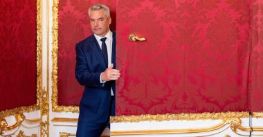 Austrian Chancellor Karl Nehammer walks at the Presidential Chancellery in Vienna, Austria, Oct. 21, 2024. (AFP Photo)