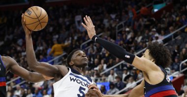Minnesota Timberwolves guard Anthony Edwards (L) goes to the basket on Detroit Pistons guard Cade Cunningham in an NBA game, Detroit, Michigan, U.S., Jan. 4, 2025. (Reuters Photo)