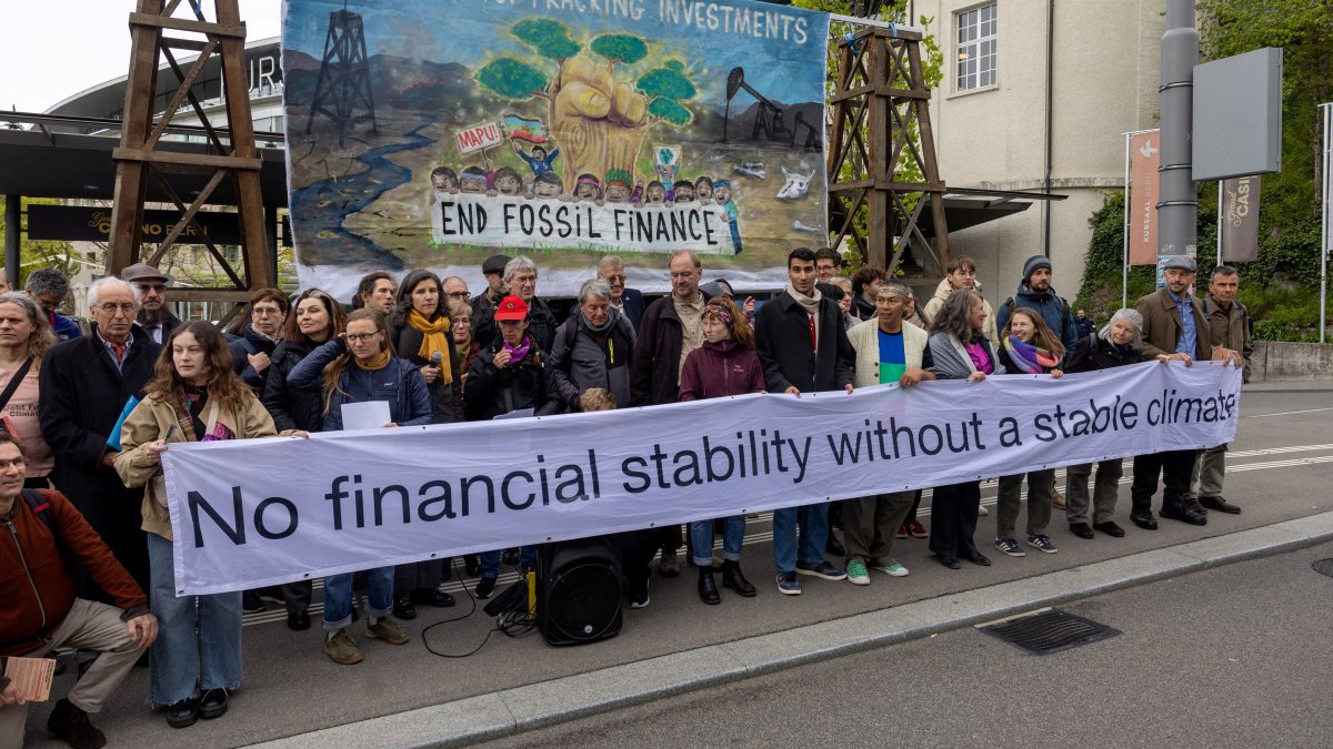 Activists protest against fossil investments before the annual general meeting of the Swiss National Bank (SNB), Bern, Switzerland, April 26, 2024. (Reuters Photo)