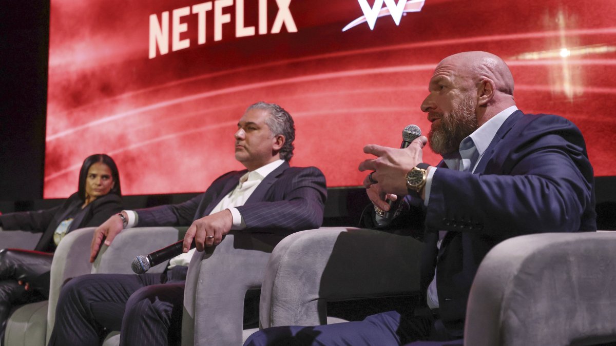 From left to right, Netflix Chief Content Officer Bela Bajaria, WWE President Nick Khan and WWE Chief Content Officer Paul "Triple H" Levesque discuss the World Wrestling Entertainment and Netflix during an event at Netflix&#039;s headquarters, Los Angeles, U.S., Dec. 3, 2024. (AP Photo)