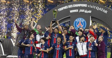 Paris Saint-Germain players celebrate with the trophy after winning the French Champions' Trophy (Trophee des Champions) final football match against AS Monaco at the Stadium 974, Doha, Qatar, Jan. 5, 2025. (AFP Photo)