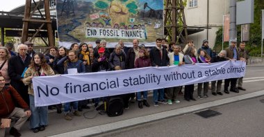 Activists protest against fossil investments before the annual general meeting of the Swiss National Bank (SNB), Bern, Switzerland, April 26, 2024. (Reuters Photo)