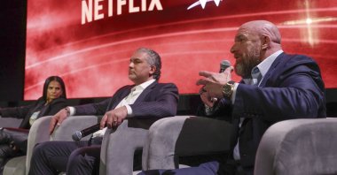 From left to right, Netflix Chief Content Officer Bela Bajaria, WWE President Nick Khan and WWE Chief Content Officer Paul "Triple H" Levesque discuss the World Wrestling Entertainment and Netflix during an event at Netflix&#039;s headquarters, Los Angeles, U.S., Dec. 3, 2024. (AP Photo)