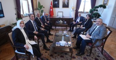 The ruling Justice and Development Party (AK Party) delegation (L) poses ahead of a meeting with the lawmakers of the Peoples' Equality and Democracy Party (DEM Party), Ankara, Türkiye, Dec. 6, 2024. (AA Photo)