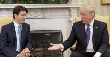 U.S. President Donald Trump and Canadian Prime Minister Justin Trudeau shake hands during a meeting in the Oval Office of the White House in Washington, D.C., Feb. 13, 2017. (AFP File Photo)