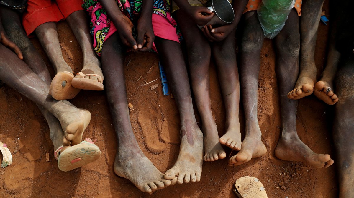 Orphans and children separated from their parents in Kadugli gather to eat boiled leaves at a camp for internally displaced people in Boram County, South Kordofan, Sudan, June 22, 2024. (Reuters Photo)