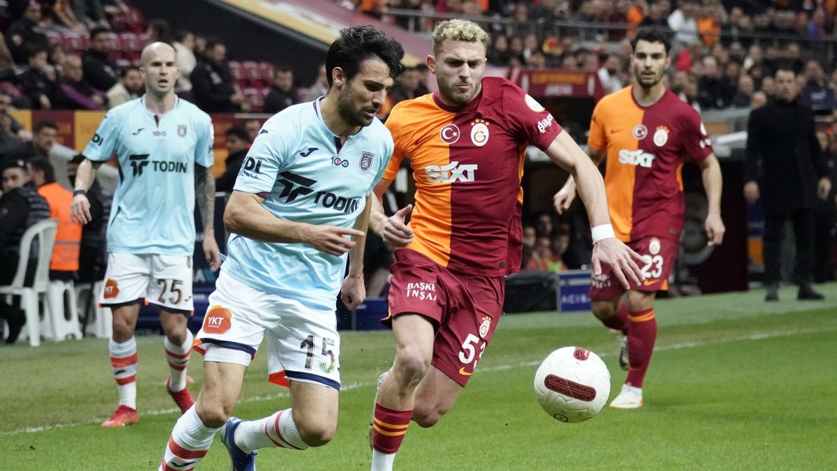 Galatasaray&#039;s Barış Alper Yılmaz (R) and Başakşehir&#039;s Leo Dubois vie for the ball during the Süper Lig match at RAMS Park, Istanbul, Türkiye, Feb. 10, 2024. (IHA Photo)