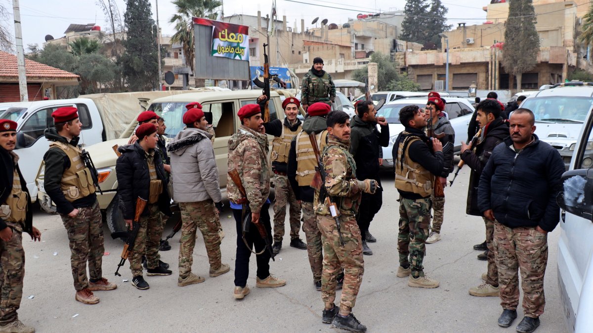 PKK/YPG terrorists stand on a street after they took control of the northeast city of Hassakeh, Syria, Dec. 8, 2024. (EPA Photo)