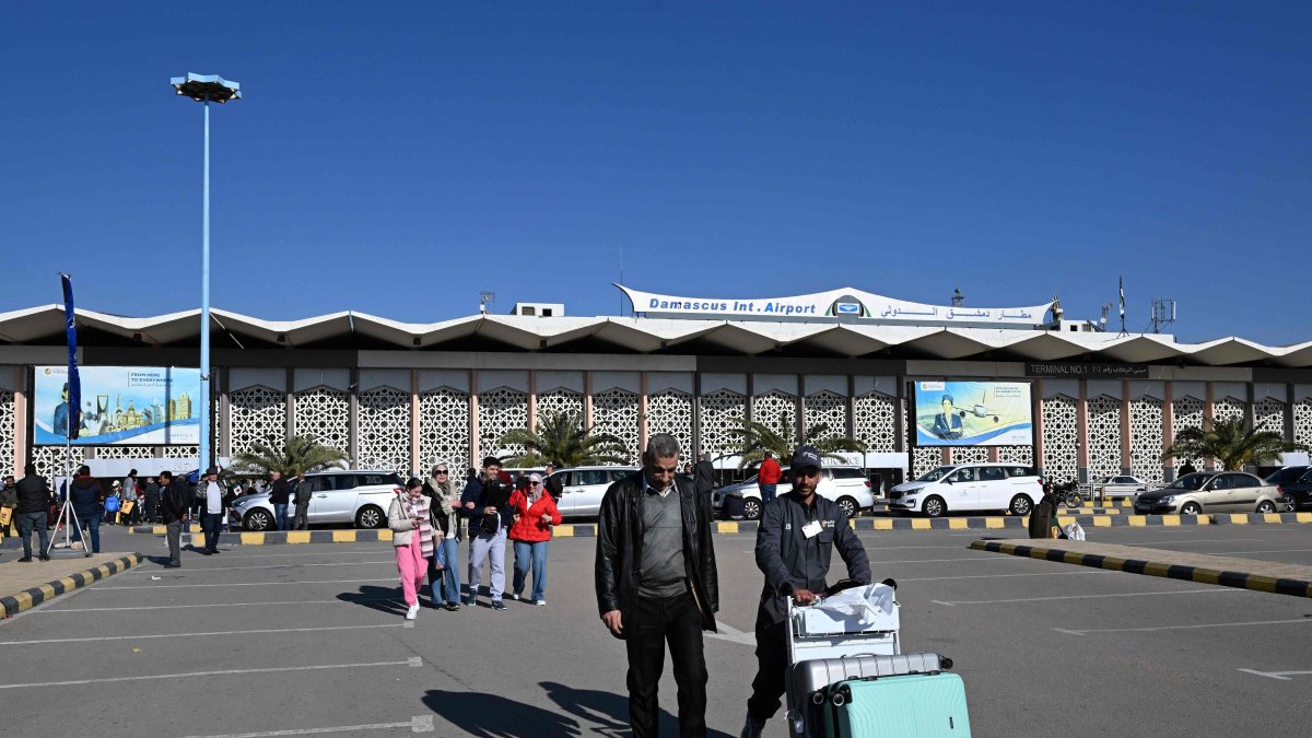 Travellers exit the Damascus International Airport, Jan. 7, 2025. (AFP Photo)