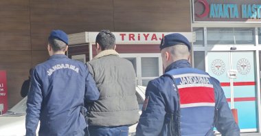 Gendarmerie officers escort a captured FETÖ suspect, Bursa, northwestern Türkiye, Jan. 3, 2025. (AA Photo)