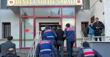 Gendarmerie officers escort a captured PKK suspect in Kayseri, central Türkiye, Dec. 25, 2024. (AA Photo) 