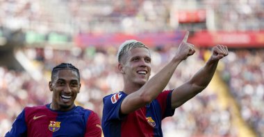 Barcelona's Dani Olmo (R) celebrates scoring his side's 6th goal during the La Liga match between Barcelona and Valladolid at the Olympic stadium, Barcelona, Spain, Aug. 31, 2024. (AP Photo)