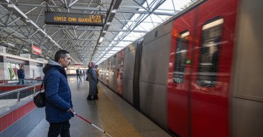A visually impaired person uses the metro, Ankara, Türkiye, Dec. 19, 2024. (AA Photo)