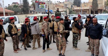 PKK/YPG terrorists stand on a street after they took control of the northeast city of Hassakeh, Syria, Dec. 8, 2024. (EPA Photo)