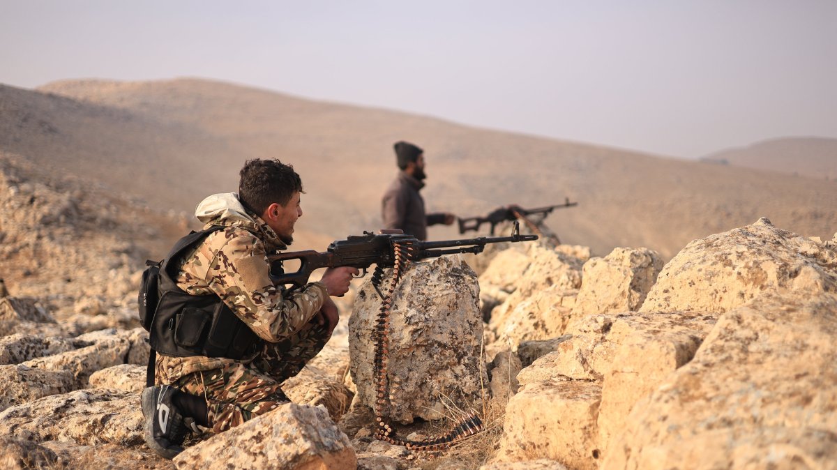 Syrian National Army (SNA) members fire at PKK/YPG terrorist positions near Manbij, Syria, Dec. 30, 2024. (AA Photo)