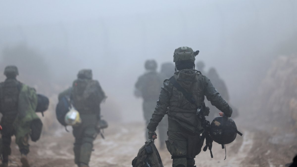 Israeli soldiers make their way to the Syrian side of the buffer zone on the border between Israel and Syria, near the Druze village of Majdal Shams, in the Israeli-occupied Golan Heights, Syria, Dec. 22, 2024. (EPA Photo)