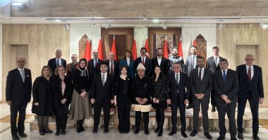 Jakarta’s Ambassador to Ankara Achmad Rizal Purnama (C) and Daily Sabah's Dilara Aslan are seen together with participants at the kick-off event at the embassy in the capital Ankara, Türkiye, Jan.7, 2025 (Courtesy of the embassy)