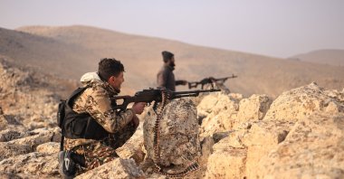 Syrian National Army (SNA) members fire at PKK/YPG terrorist positions near Manbij, Syria, Dec. 30, 2024. (AA Photo)