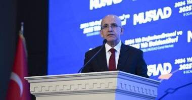 Treasury and Finance Minister Mehmet Şimşek delivers a speech at an event, organized by the Independent Industrialists and Businessmen’s Association (MÜSIAD), Istanbul, Türkiye, Jan. 8, 2025. (AA Photo)