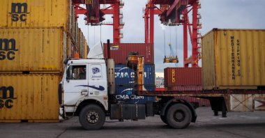 A truck waits to be loaded with a container at the Mediterranean port of Latakia in western Syria, Dec. 30, 2024. (AFP Photo)
