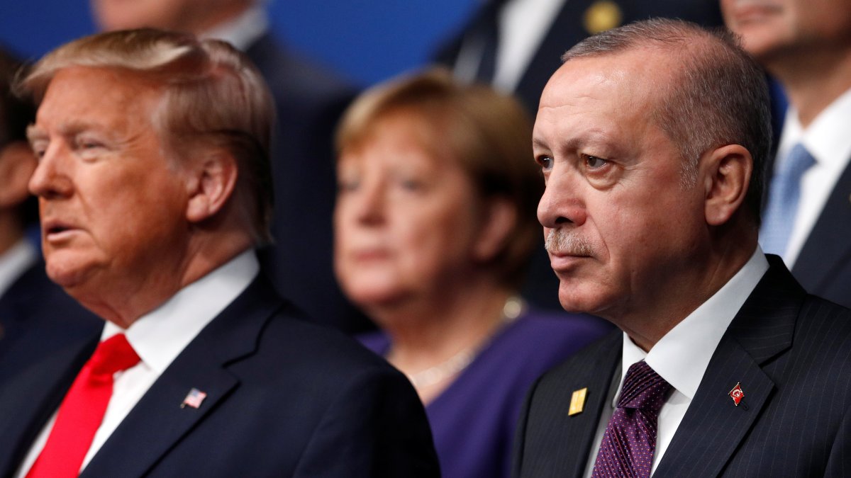 U.S. President Donald Trump and President Recep Tayyip Erdoğan pose for a group photo during the annual NATO heads of government summit at the Grove Hotel in Watford, Britain, December 4, 2019.  (REUTERS Photo)