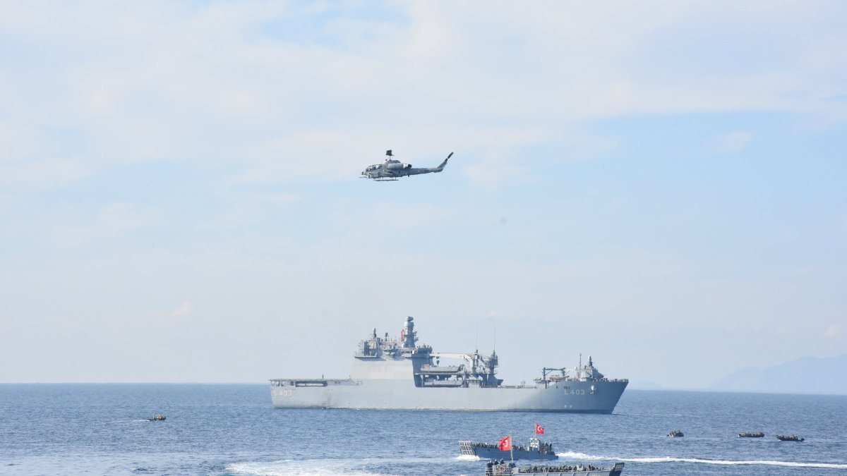 A view of naval vessels and a helicopter during the Blue Homeland exercises off the coast of Muğla, southwestern Türkiye, Jan. 9, 2025. (AA Photo)