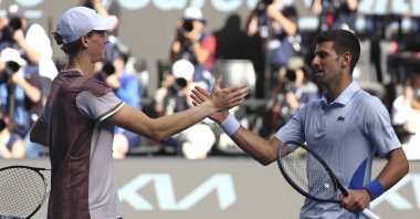 Italy&#039;s Jannik Sinner (L) is congratulated by Serbia&#039;s Novak Djokovic following their semifinal at the Australian Open at Melbourne Park, Melbourne, Australia, Jan. 26, 2024. (AP Photo)