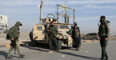 Members of the PKK/YPG terrorist group stand along a street after anti-regime forces seized the capital and ousted Syria's Bashar Assad, Hasakah, Syria, Dec. 11, 2024. (Reuters Photo)