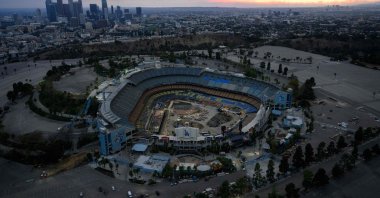 The sun sets behind smoke covering the downtown Los Angeles skyline and Dodger Stadium from wildfires, Los Angeles, California, U.S., Jan. 8, 2025. (AFP Photo)