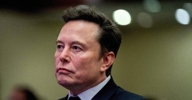 Tesla CEO and X owner Elon Musk listens as U.S. President-elect Donald Trump speaks during a meeting with House Republicans at the Hyatt Regency Hotel in Washington, D.C., U.S., Nov.13, 2024. (Reuters File Photo)