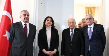 Nationalist Movement Party (MHP) leader Devlet Bahçeli (2nd R) poses ahead of a meeting with Peoples' Equality and Democracy Party (DEM Party) lawmakers Pervin Buldan (2nd L), Sırrı Süreyya Önder (L) and Ahmet Türk (R) at Parliament, Ankara, Türkiye, Jan. 2, 2024. (AA Photo)