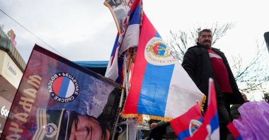 A man sells a flag depicting Bosnian Serb wartime commander Ratko Mladic, ahead of the parade marking the 33rd anniversary of the 'Day of Republika Srpska', Banja Luka, Bosnia-Herzegovina, Jan. 9, 2025. (EPA Photo)