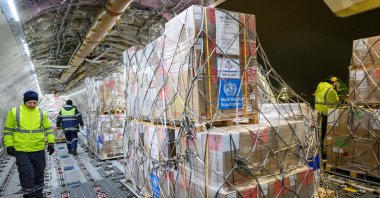 Workers unload medical and health supplies to Syria, delivered by the World Health Organization (WHO), at the Istanbul International Airport, Istanbul, Türkiye, Dec. 26, 2024. (AFP Photo)