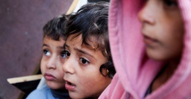 Palestinian children react at a tent camp sheltering displaced people, following an Israeli strike in al-Mawasi area, Khan Younis, southern Gaza Strip, Jan. 2, 2025. (Reuters Photo)