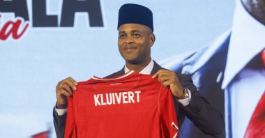Indonesia head coach Patrick Kluivert poses with a jersey during a press conference in Jakarta, Indonesia, Jan. 12, 2025. (EPA Photo)