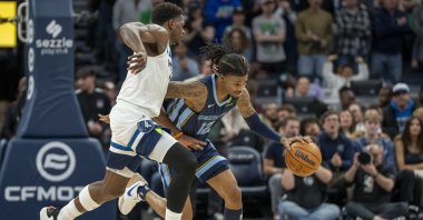 Memphis Grizzlies guard Ja Morant (R) dribbles the ball around Minnesota Timberwolves guard Anthony Edwards in an NBA game in Minneapolis, Minnesota, U.S., Jan 11, 2025. (Reuters Photo)