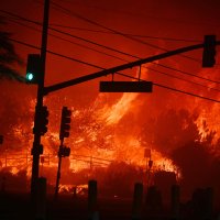 Flames overtake the intersection of Temescal Canyon and the Pacific Coast Highway in Pacific Palisades, California, U.S., Jan. 7, 2025. (AFP Photo)