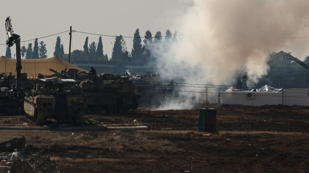 An Israeli soldier sits on top of a tank at a camp near the Israel-Gaza border, Jan. 12, 2025. (Reuters Photo)