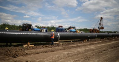 Workers stand near a pipe at a construction site on the extension of Russia&#039;s TurkStream gas pipeline, Letnitsa, Bulgaria, June 1, 2020. (Reuters Photo)