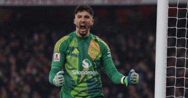 Manchester United&#039;s Altay Bayındır celebrates after saving a penalty from Arsenal&#039;s Kai Havertz during an FA Cup third-round shoot-out, London, U.K., Jan. 12, 2025.