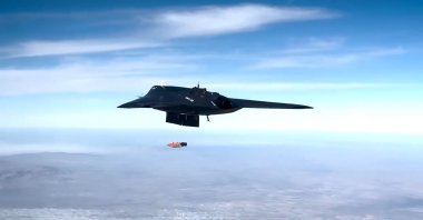 This still image taken from a handout video shows the TOLUN guided munition being fired from the Anka-3 combat drone. (DHA Photo)