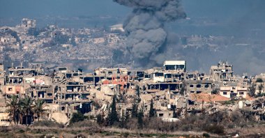 This picture taken from the Israeli side of the border with the Gaza Strip shows a smoke plume rising from buildings destroyed by Israeli strikes in the northern Gaza Strip, Jan. 13, 2025. (AFP Photo)